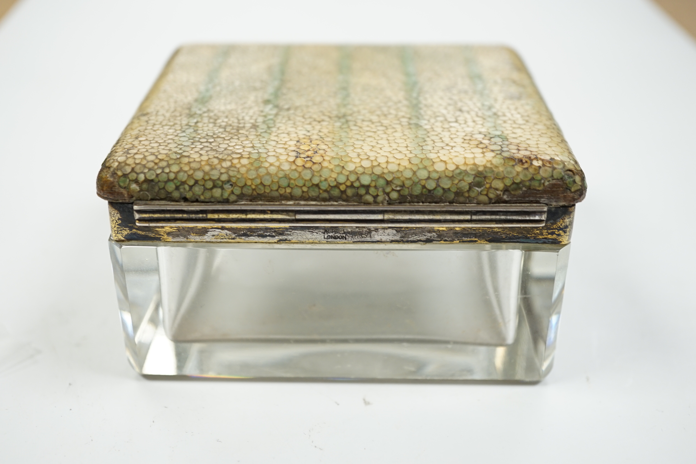 A George V silver and shagreen mounted glass square toilet box, with hinged cover, by George Betjemann & Sons Ltd, London, 1927, retailed by Asprey, London, width 94mm.